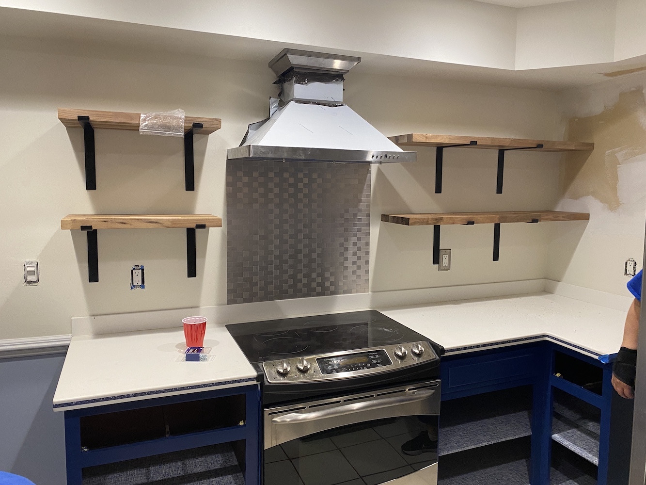 Custom kitchen shelves and hood.